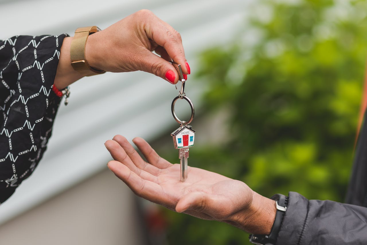 A real estate professional handing the keys over to the buyer